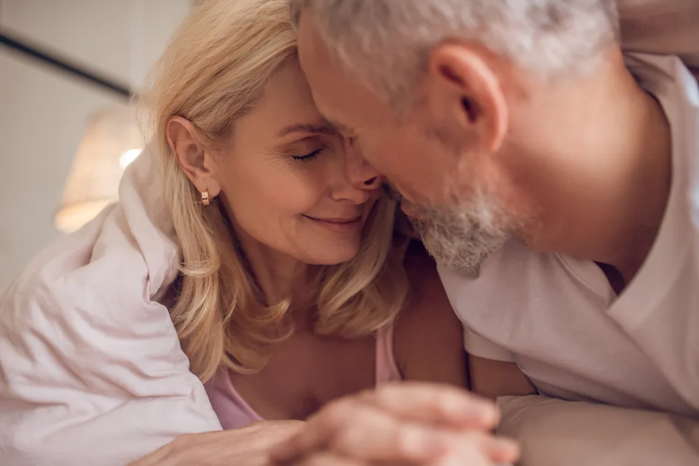 an elderly couple feeling romantic